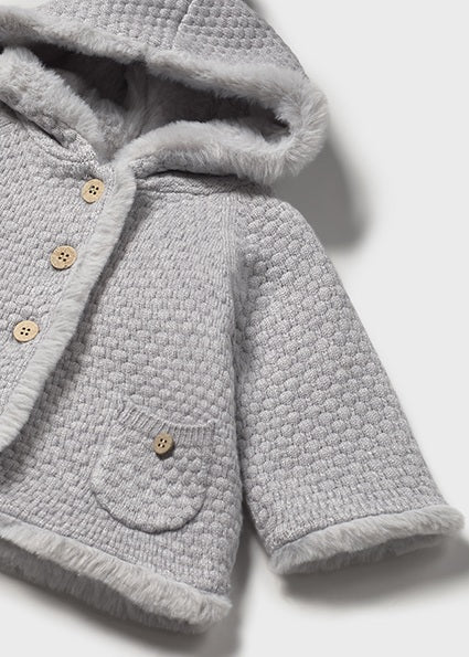 Giacca in maglia con pellicciotto neonata